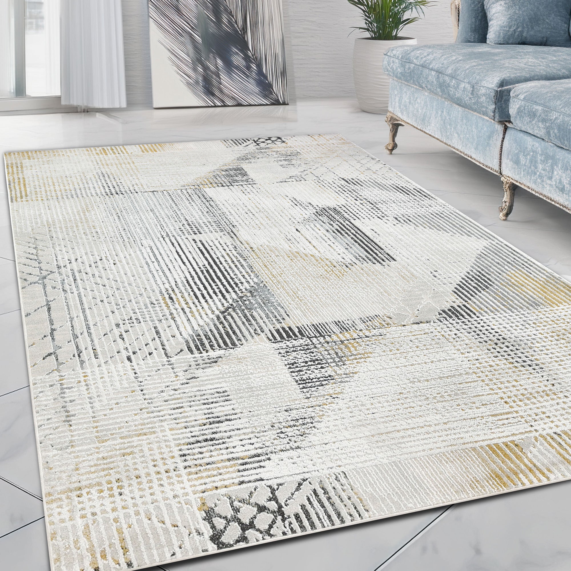 Modern abstract rug with a weathered gray, yellow, white, beige, and black design
